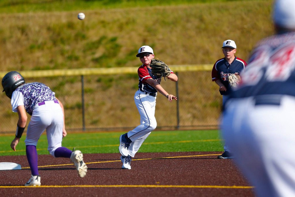 Everett All Star Jimi Orr turns a 6-3 double play on a hard grounder up the middle against Lake Stevens during a 12u Little League matchup on Wednesday, July 5, 2023, at the Phil Johnson Ballfields in Everett, Washington. (Ryan Berry / The Herald)