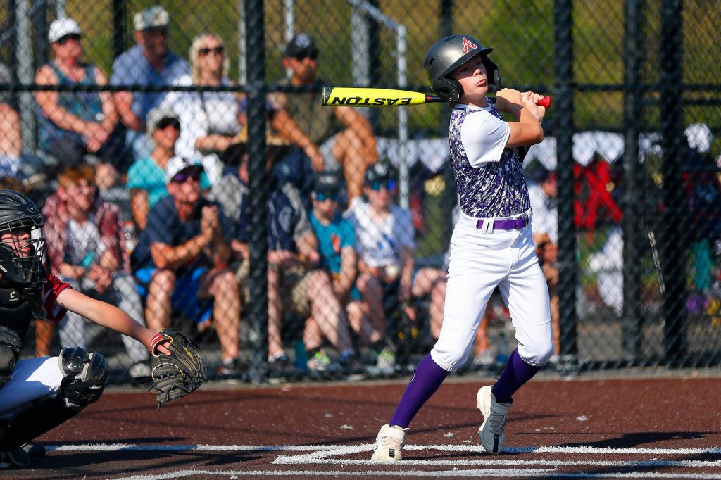 Lake Stevens All Star Carson Philips smacks a ball foul before ultimately drawing a walk in an at bat against Everett during a 12u Little League matchup on Wednesday, July 5, 2023, at the Phil Johnson Ballfields in Everett, Washington. (Ryan Berry / The Herald)