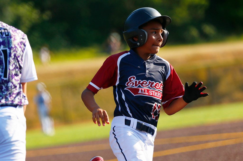 Everett All Star Gabriel Ortiz rounds third and heads home to put his team up against Lake Stevens during a 12u Little League matchup on Wednesday, July 5, 2023, at the Phil Johnson Ballfields in Everett, Washington. (Ryan Berry / The Herald)