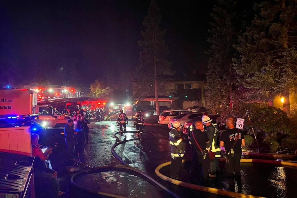 Firefighters respond to a fire at the Lake Village condos on Lakeshore Drive Monday night, July 3, 2023 in Mountlake Terrace, Washington. (Photo provided by South County Fire)