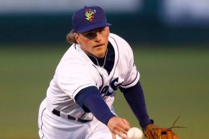 AquaSox second baseman Blake Rambusch shovels a ball over to first on a slow dribbler during the season opener against the Eugene Emeralds on Friday, April 7, 2023, at Funko Field in Everett, Washington. (Ryan Berry / The Herald)