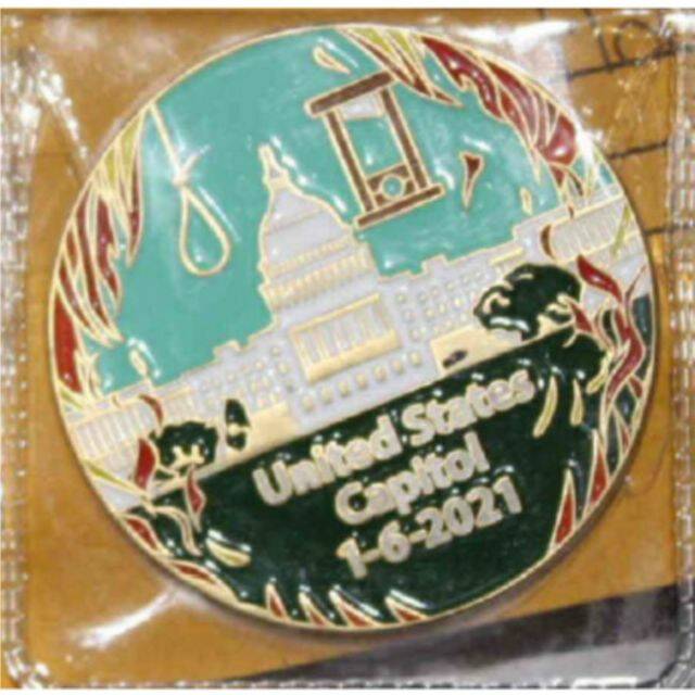 The “challenge coin” Scott made in the days following Jan. 6, 2021, to celebrate the Proud Boys’ breach of the Capitol building, featuring a noose, guillotine, and flames. (U.S. Attorney's Office)