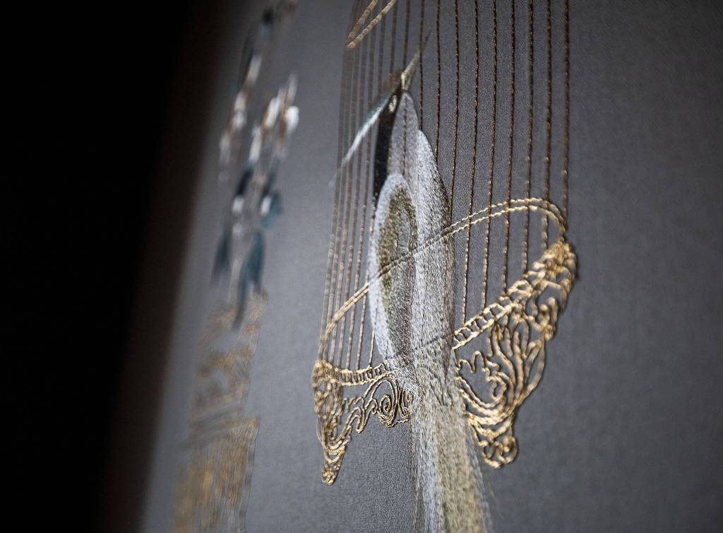Light reflects off of the imported embroidered wallpaper inside one of the sittings rooms at the Muse Whiskey & Coffee Bar on Wednesday, July 12, 2023 in Everett, Washington. (Olivia Vanni / The Herald)