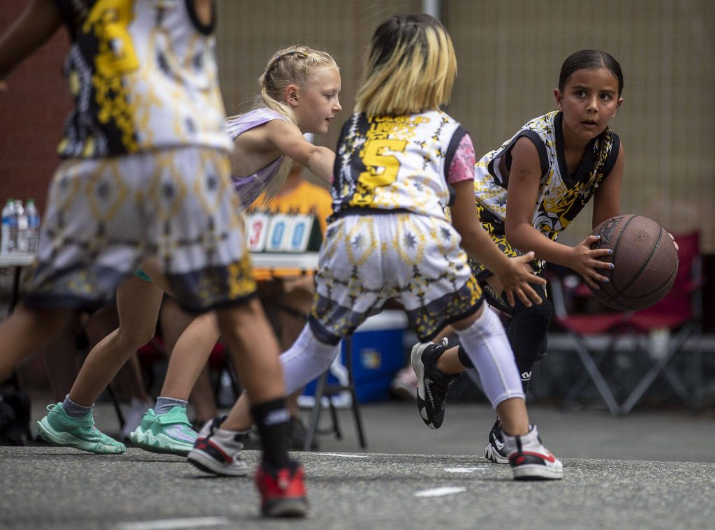 Girls play in the Youth Division during the Everett 3on3 tournament Sunday in downtown Everett. (Annie Barker / The Herald)