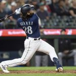 Seattle Mariners Eugenio Suarez hits a two-run home run off Minnesota Twins relief pitcher Oliver Ortega during the seventh inning of Mondays game in Seattle. (AP Photo/Stephen Brashear)