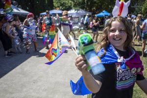A child blows bubbles during the second annual Arlington Pride at Legion memorial Park in Arlington, Washington on Saturday, July 22, 2023. (Annie Barker / The Herald)