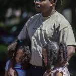 Left to right, Zoë Lindsey, 6, Nigel Lindsey, 31, and Aribella Lindsey, 7, listen during a NAACP Snohomish County press conference at Lynnwood City Hall in Lynnwood, Washington on Thursday, July 20, 2023. (Annie Barker / The Herald)