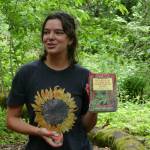 Carly Lloyd, North Sound Regional Coordinator for the Center for Responsible Forestry, recommends a guidebook to volunteer forest surveyors. (Photo provided by Julie Titone)