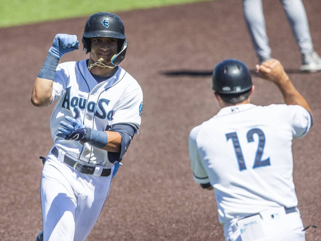 AquaSoxs Axel Sanchez celebrates with his home run during the game against the Tri-City Dust Devils on Wednesday, July 19, 2023 in Everett, Washington. (Olivia Vanni / The Herald)