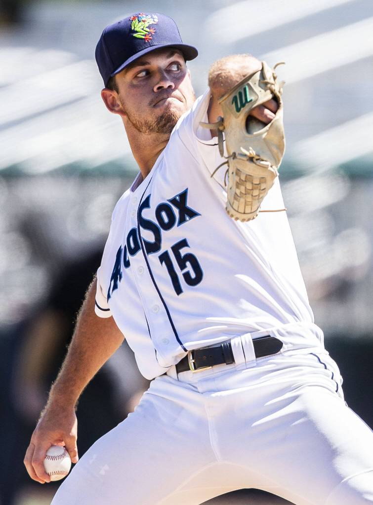 AquaSox pitchers Kyle Hill winds up to pitch during the game against the Tri-City Dust Devils on Wednesday, July 19, 2023 in Everett, Washington. (Olivia Vanni / The Herald)