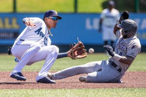 AquaSox second baseman Axel Sanchez tags out Tri-City’s D’Shawn Knowles during the game on Wednesday, July 19, 2023 in Everett, Washington. (Olivia Vanni / The Herald)