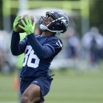 Seattle Seahawks wide receiver Easop Winston Jr. reaches for a pass during an NFL football practice, Wednesday, June 7, 2023, team's facilities in Renton, Wash. (AP Photo/John Froschauer)
