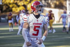 Stanwood’s Ryder Bumgarner yells in celebration after scoring a touchdown during the 3A quarterfinal game against Odea on Saturday, Nov. 19, 2022 in Seattle, Washington. (Olivia Vanni / The Herald)
