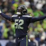 Seahawks defensive end Darrell Taylor (52) celebrates after sacking Rams quarterback Baker Mayfield during the second half of a game on Jan. 8 in Seattle. (AP Photo/Abbie Parr)