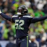 Seattle Seahawks defensive end Darrell Taylor (52) celebrates after his sack of Los Angeles Rams quarterback Baker Mayfield during the second half of an NFL football game Sunday, Jan. 8, 2023, in Seattle. (AP Photo/Abbie Parr)