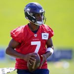 Seattle Seahawks quarterback Geno Smith holds a football during the NFL football team's training camp Thursday, July 27, 2023, in Renton, Wash. (AP Photo/Lindsey Wasson)