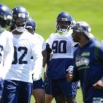 Members of the Seattle Seahawks defense, including defensive end Jarran Reed (90) practice during minicamp Tuesday, June 6, 2023, at the NFL football team's facilities in Renton, Wash. (AP Photo/Lindsey Wasson)