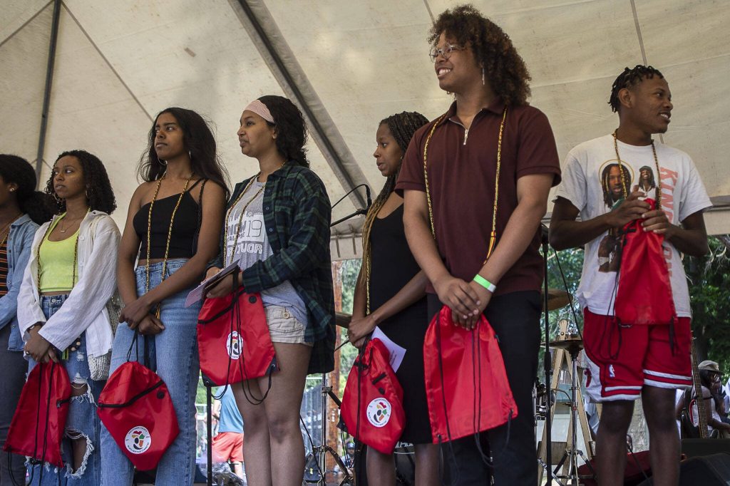 High school graduates are recognized during the Nubian Jam at Forest Park in Everett, Washington on Saturday, July 29, 2023. (Annie Barker / The Herald)
