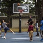 People play basketball during the Nubian Jam at Forest Park in Everett, Washington on Saturday, July 29, 2023. (Annie Barker / The Herald)