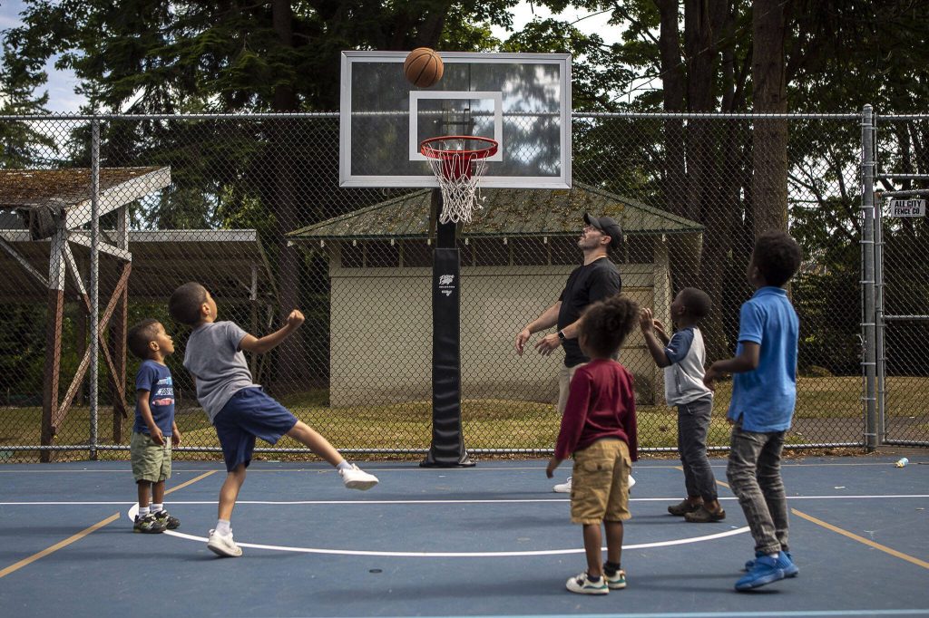 People play basketball during the Nubian Jam at Forest Park in Everett, Washington on Saturday, July 29, 2023. (Annie Barker / The Herald)