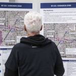 A man stops to look through the proposed Link light rail station for SR 526 and Evergreen Way on Wednesday, Feb. 15, 2023 in Everett, Washington. (Olivia Vanni / The Herald)