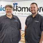 Original MicroHomebrew owner Tony Ochsner, left, and soon to be owner Corey DeJong, right, at their store on Monday, Aug. 7, 2023 in Kenmore, Washington. (Olivia Vanni / The Herald)