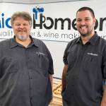 Original MicroHomebrew owner Tony Ochsner, left, and soon to be owner Corey DeJong, right, at their store on Monday, Aug. 7, 2023 in Kenmore, Washington. (Olivia Vanni / The Herald)