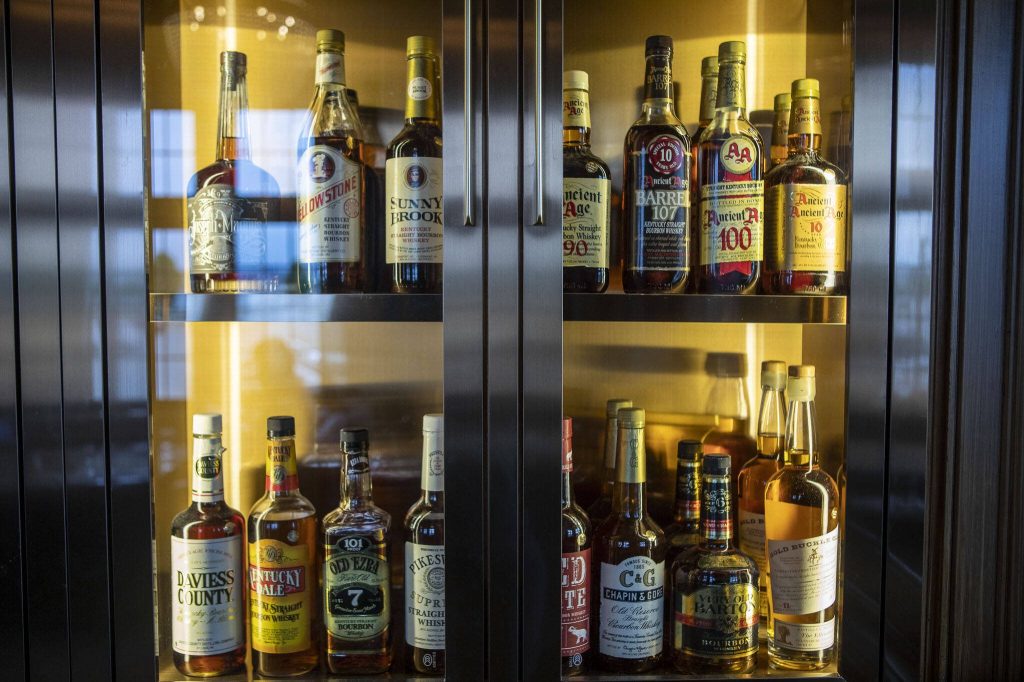 A collection of whiskey on display at the Muse Whiskey and Coffee in Everett, Washington on Monday, July 24, 2023. (Annie Barker / The Herald)