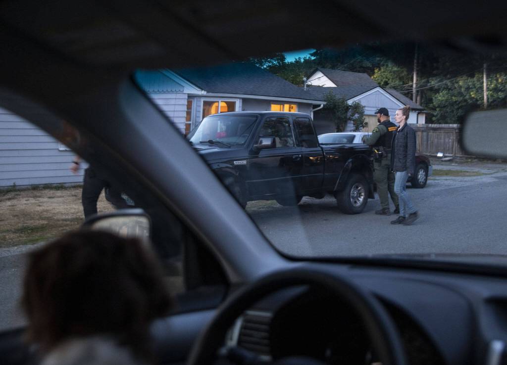 Jessi Beyer and Snohomish County Sheriff deputies attempt to make contact with a juvenile potentially experiencing a mental health crisis on Wednesday, Aug. 2, 2023, in Snohomish, Washington. (Olivia Vanni / The Herald)