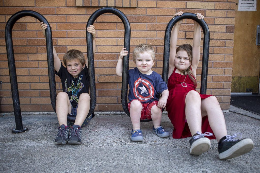 From left, siblings Mason Boucher, 8, Karter Boucher, 2, and Mia Boucher, 9. On Wednesday, the family will will have to leave the shelter and move into their van. (Annie Barker / The Herald)