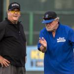 Everett Merchants manager Harold Pyatte (right) argues with an umpire during a game on Friday at Funko Field in Everett. (Annie Barker / The Herald)