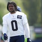 Seattle Seahawks linebacker Devin Bush (0) walks off the field following a "Back Together Weekend" event at the NFL football team's training facility, Sunday, July 30, 2023, in Renton, Wash. (AP Photo/Lindsey Wasson)