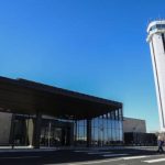 People arrive at the entrance to the terminal during the grand-opening of the Paine Field Airport on Monday, March 4, 2019 in Everett, Wash. (Olivia Vanni / The Herald)