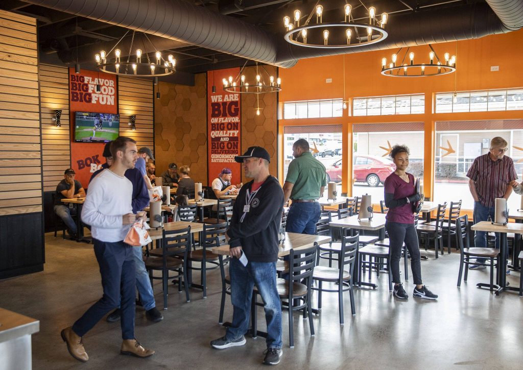 People look for seating and pick up food at Big Chicken on Thursday, Aug. 10, 2023 in Mukilteo, Washington. (Olivia Vanni / The Herald)