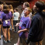 Brendan Stinson watches as the stage crew lowers a chandelier during a dress rehearsal for Hope Theatres rendition of Beauty and the Beast Jr. on Friday, Aug. 4, 2023, at the Snohomish County PUDs theater in Everett, Washington. (Olivia Vanni / The Herald)
