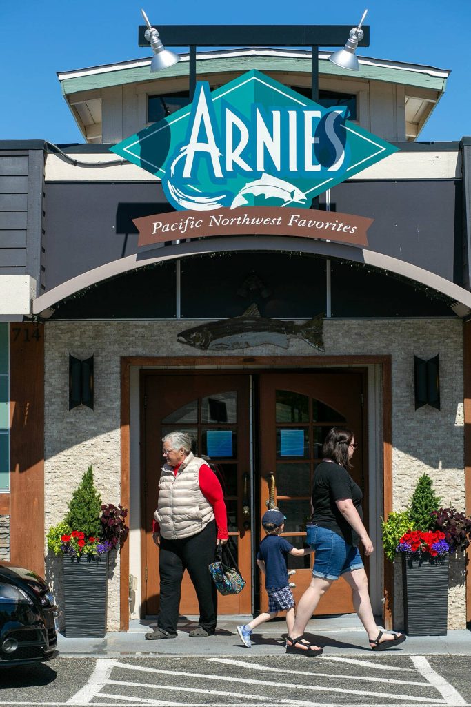 People come and go during the lunch hour at Arnies restaurant on Friday, August 11, 2023, in Mukilteo, Washington. (Ryan Berry / The Herald)