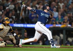The Mariners Cal Raleigh watches his two-run home run next to Padres catcher Luis Campusano during the eighth inning of a game Wednesday in Seattle. (AP Photo/Lindsey Wasson)