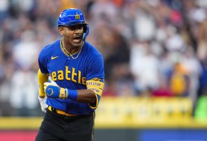 The Mariners Julio Rodríguez yells as he runs the bases on a three-run home run during the fourth inning of a game against the Orioles on Friday in Seattle. (AP Photo/Lindsey Wasson)