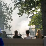 Residents from an adjacent complex watch smoke fill the air during an apartment fire at the Park 120 apartment complex on Casino Road on Friday, August 11, 2023, in Everett, Washington. (Ryan Berry / The Herald)