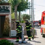 Emergency responders work the scene of an apartment fire at the Park 120 apartment complex on Casino Road on Friday, August 11, 2023, in Everett, Washington. (Ryan Berry / The Herald)