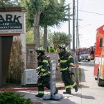Emergency responders work the scene of an apartment fire at the Park 120 apartment complex on Casino Road on Friday, August 11, 2023, in Everett, Washington. (Ryan Berry / The Herald)