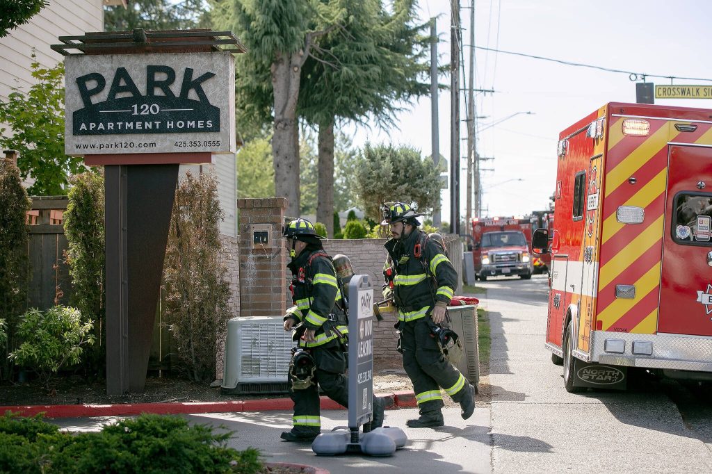 Emergency responders work the scene of an apartment fire at the Park 120 apartment complex on Casino Road on Friday, August 11, 2023, in Everett, Washington. (Ryan Berry / The Herald)