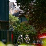Emergency responders work the scene of an apartment fire at the Park 120 apartment complex on Casino Road on Friday, Aug. 11, 2023, in Everett, Washington. (Ryan Berry / The Herald)