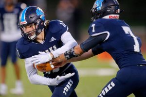 Sultan’s Derek Feltner takes a handoff from quarterback Westin Galle against Granite Falls on Friday, Sep. 30, 2022, at Sultan High School in Sultan, Washington. (Ryan Berry / The Herald)