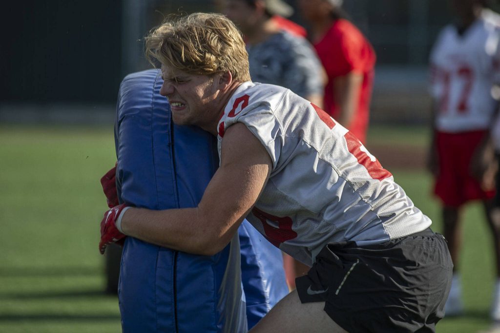 A player runs a play during a football practice Thursday at Mountlake Terrace High School. (Annie Barker / The Herald)