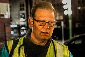 Dr. Jimmy Grierson, founder of the Safe Harbor Free Clinic in Stanwood and a Providence physician, had just come from work when he arrived to volunteer with MercyWatch on a recent Tuesday night.  The faith-based group provides medical care, supplies and food to people living on the streets.  (Dan Bates / The Herald)