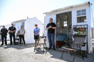 Patrick Diller, head of community partnerships for Pallet, discusses the Pallet Shelter Pilot Project last June in Everett. (Katie Hayes / Herald file)