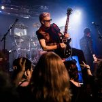 Dave Dodge stands on a speaker while playing his guitar during Nite Waves show at Tony Vs Garage on Saturday, June 8, 2019 in Everett, Wash. (Olivia Vanni / The Herald)