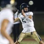 Arlingtons Jacoby Falor throws the ball during a game against Marysville Getchell on Sept. 9, 2022, in Marysville. (Olivia Vanni / The Herald)