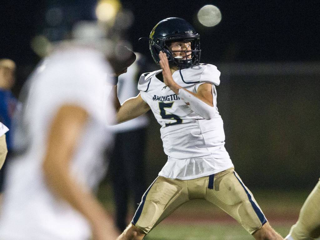 Arlingtons Jacoby Falor throws the ball during a game against Marysville Getchell on Sept. 9, 2022, in Marysville. (Olivia Vanni / The Herald)